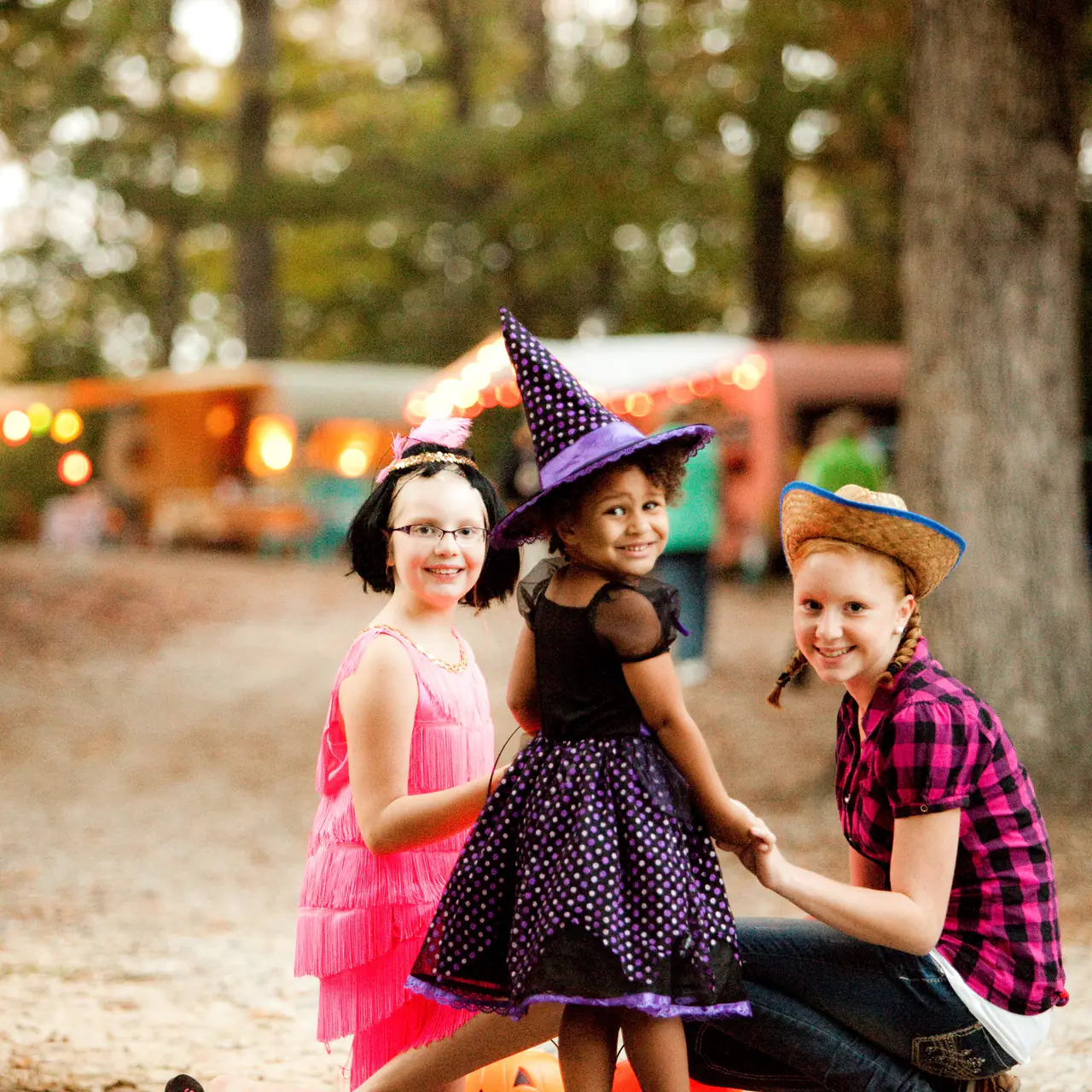 Kids in Halloween costumes at a campground event